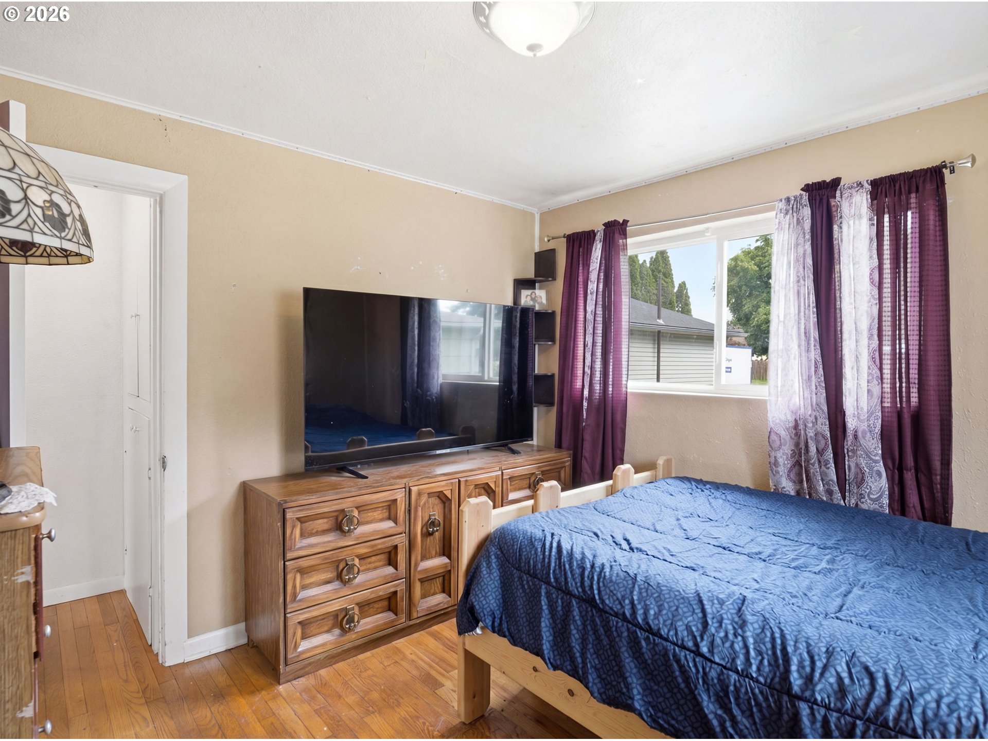 1357 Grove Street Lebanon, OR 97355 - Photo 14 of 37 a bedroom with a bed and a flat screen tv