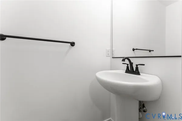 a bathroom with a sink and mirror