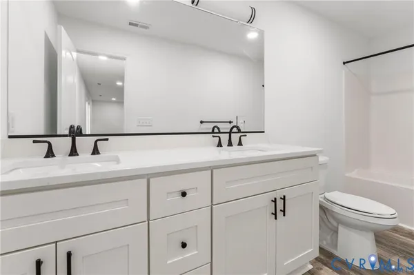 a bathroom with a sink and a toilet
