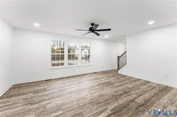 a view of an empty room with a window