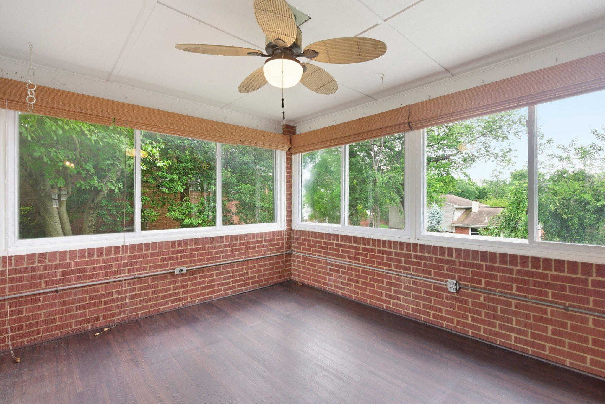 1110 Chillum Manor Road Hyattsville, MD 20783 - Photo 11 of 30 Enclosed sunroom with multiple windows.