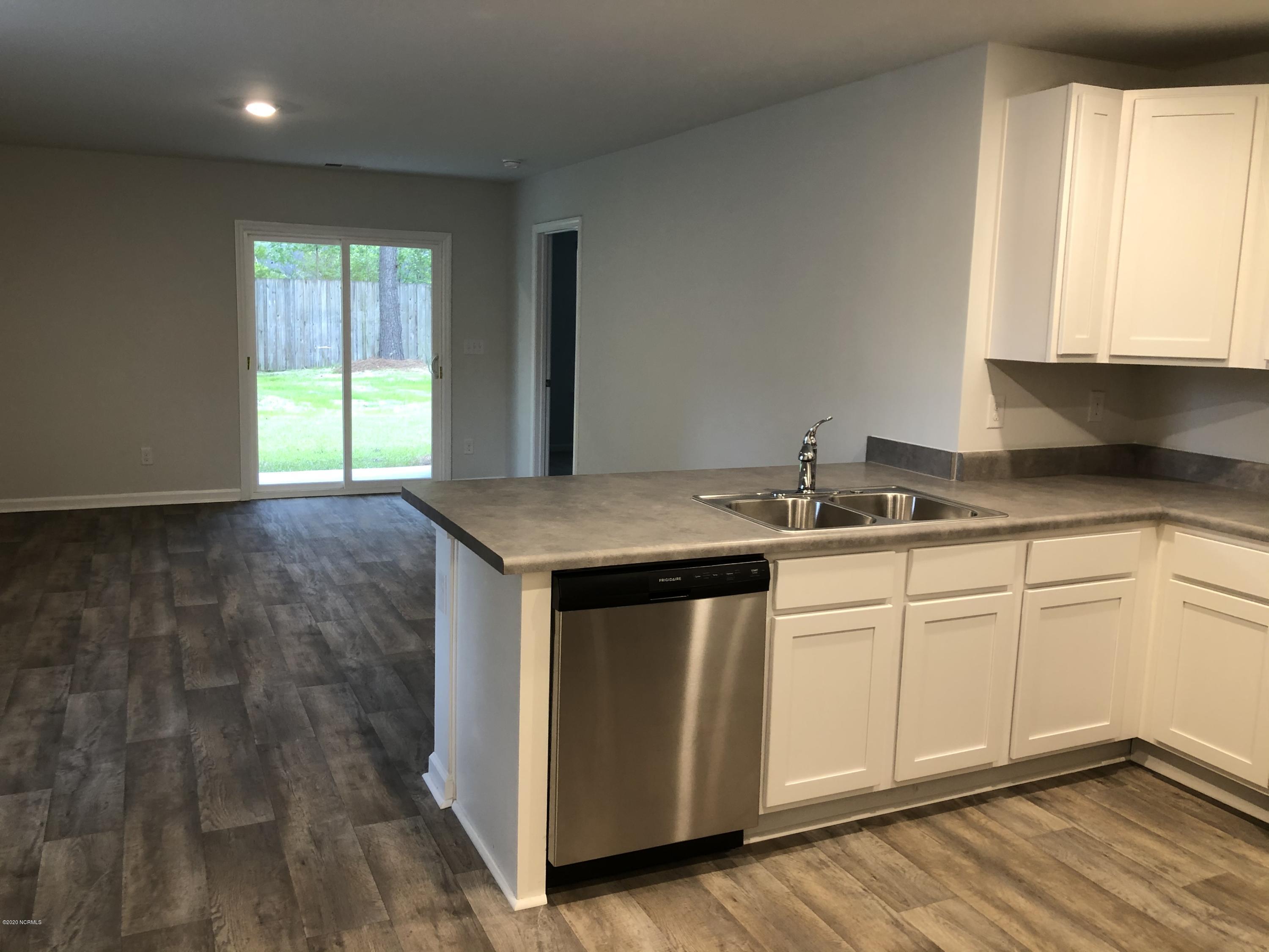 391 Ellis Road Southeast, Unit LOT #29 Bolivia, NC 28422 - Photo 5 of 29 Kitchen/Breakfast Bar