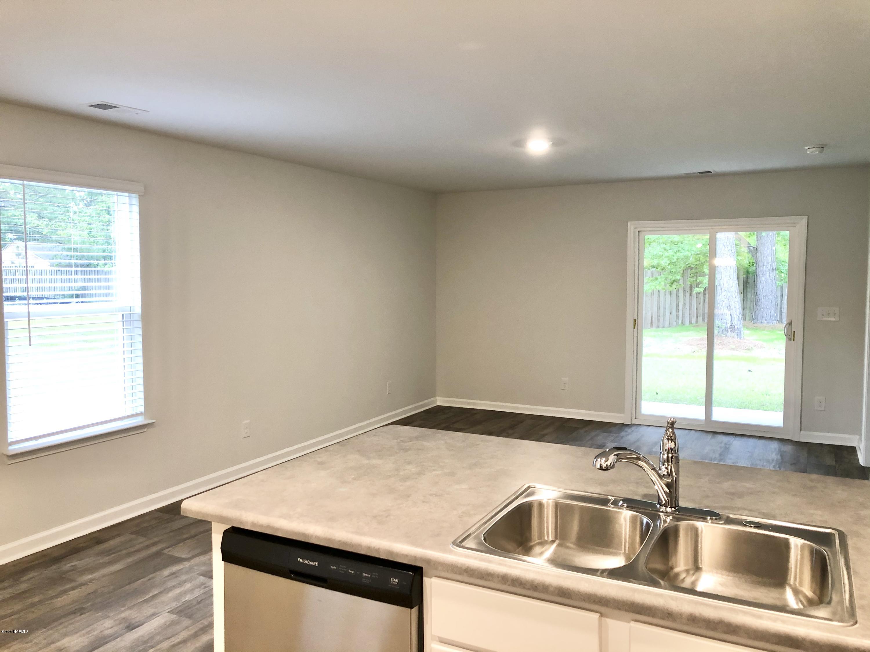 391 Ellis Road Southeast, Unit LOT #29 Bolivia, NC 28422 - Photo 7 of 29 Kitchen/Living Room