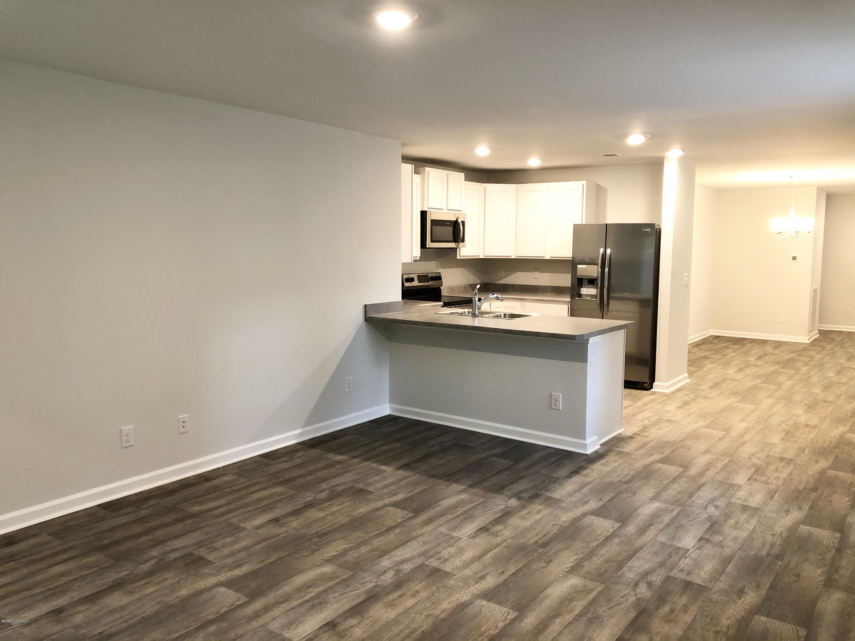 391 Ellis Road Southeast, Unit LOT #29 Bolivia, NC 28422 - Photo 8 of 29 Living Room and Kitchen