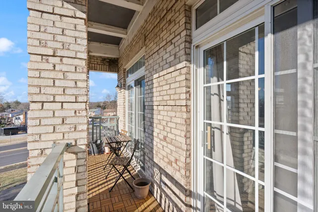 a view of a balcony with wooden floor
