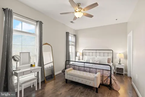 a bedroom with furniture and a window