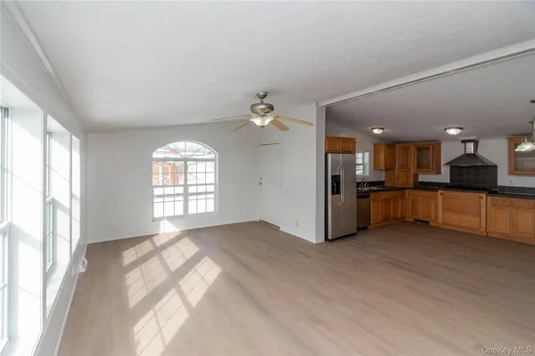 a view of a kitchen with a sink and a window