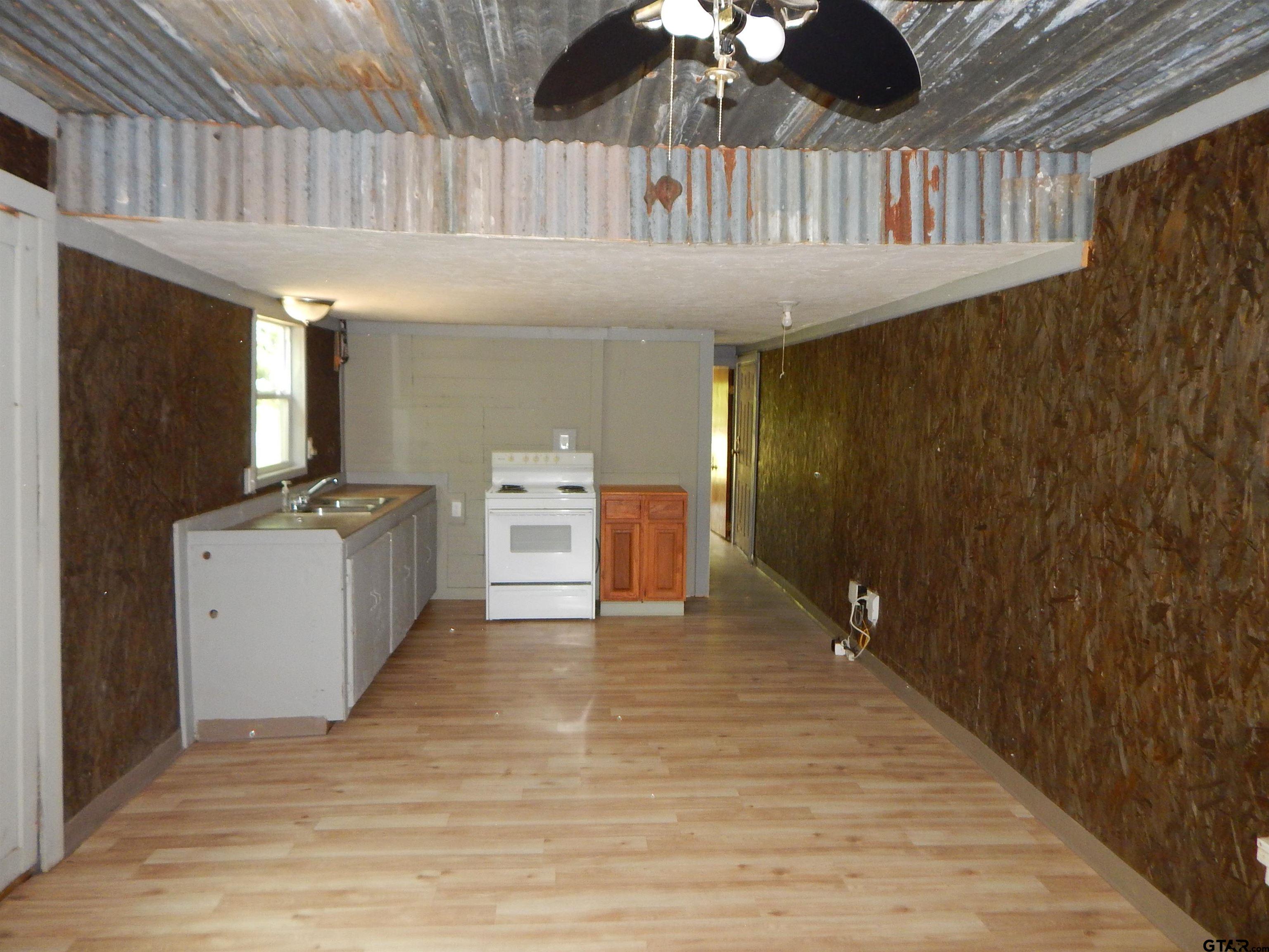 214 Lawrence Street Gilmer, TX 75644 - Photo 5 of 11 a room with table and chairs