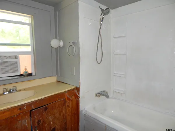 a bathroom with a sink and a bathtub
