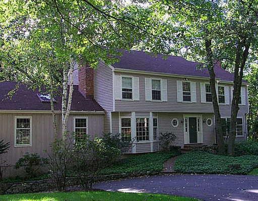 34 Silver Ridge Common Weston, CT 06883 - Photo 1 of 1 a front view of a house with yard and green space