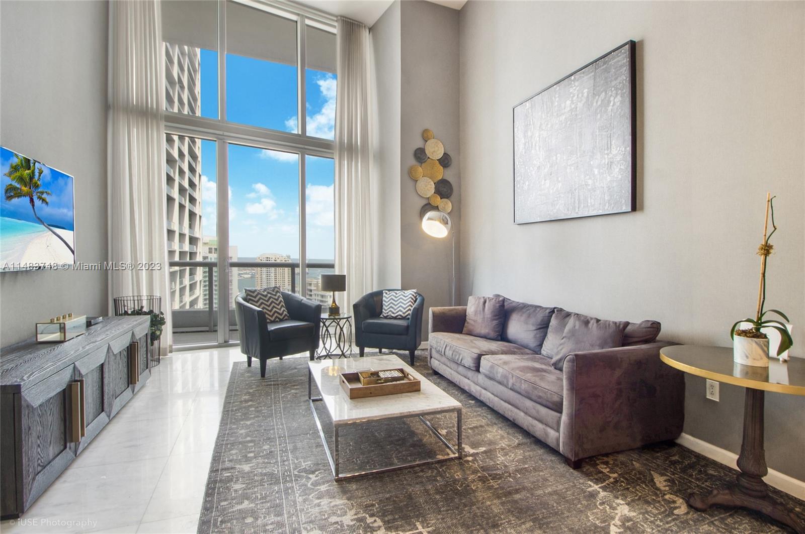 Brickell Miami, FL 33131 - Photo 1 of 10 a living room with furniture and a window