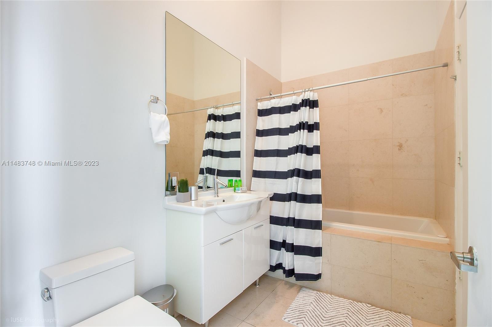 Brickell Miami, FL 33131 - Photo 9 of 10 a bathroom with a sink toilet and shower