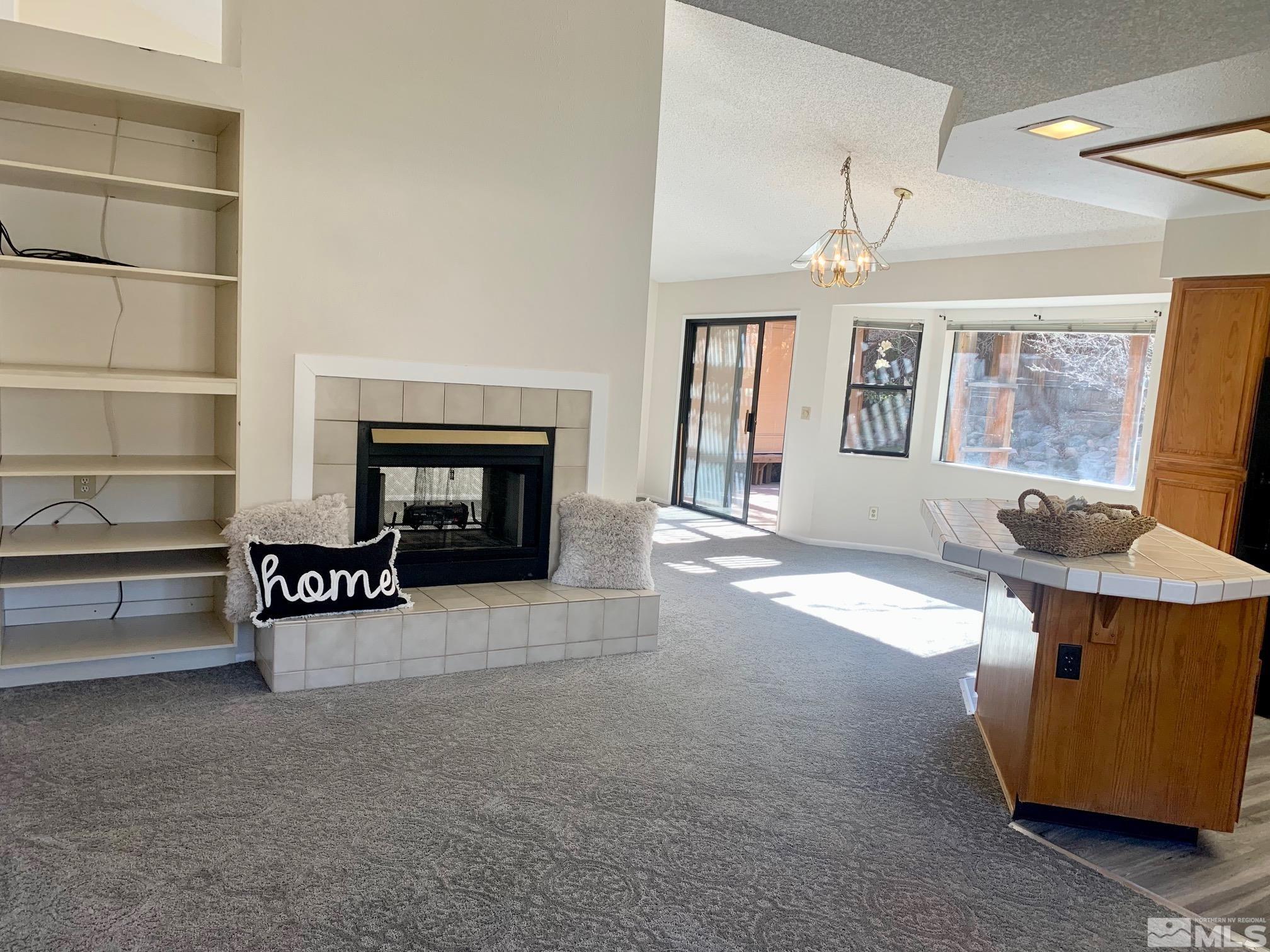3070 Bramble Drive Reno, NV 89509 - Photo 7 of 23 a living room with furniture and a fireplace
