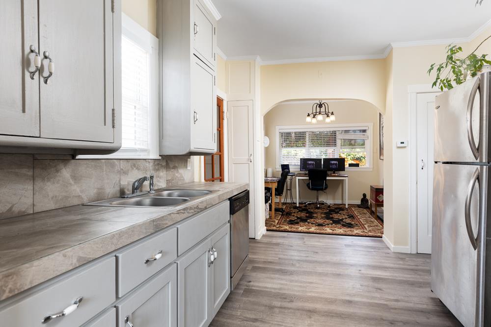 2211 Capitola Road Santa Cruz, CA 95062 - Photo 6 of 20 a kitchen with refrigerator and cabinets