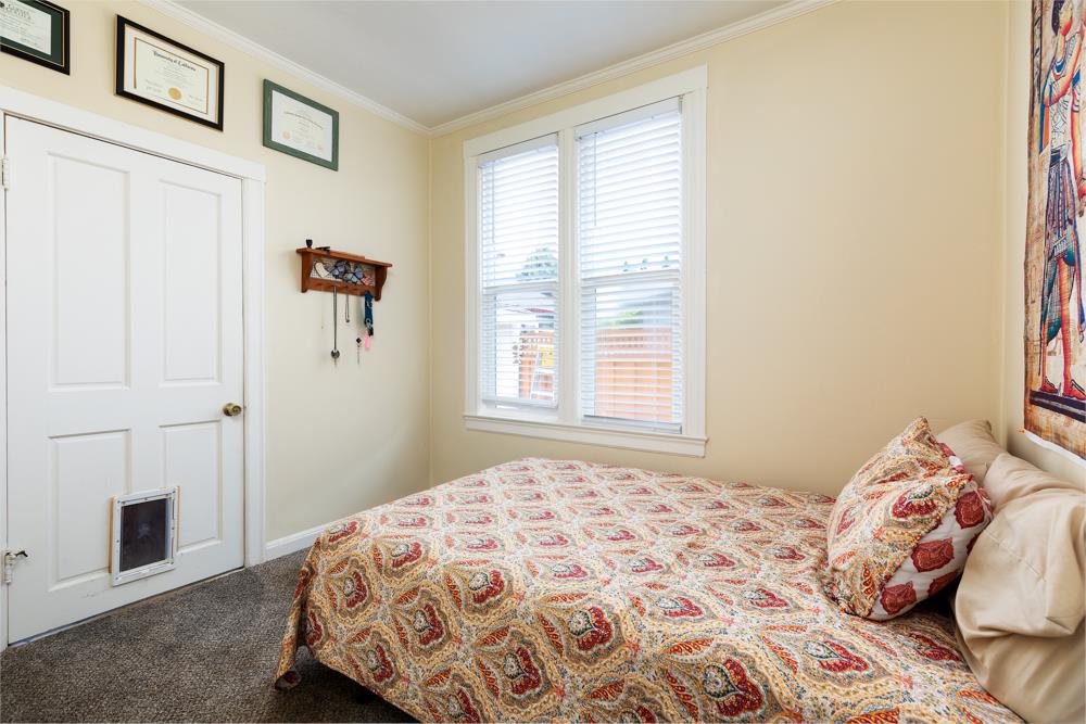 2211 Capitola Road Santa Cruz, CA 95062 - Photo 10 of 20 a bedroom with a bed and a window