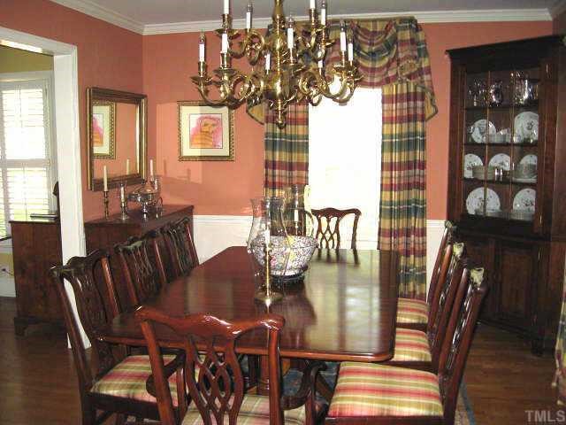 2400 Ridge Road Raleigh, NC 27612 - Photo 3 of 12 Formal dining room with chair rail & hardwoods