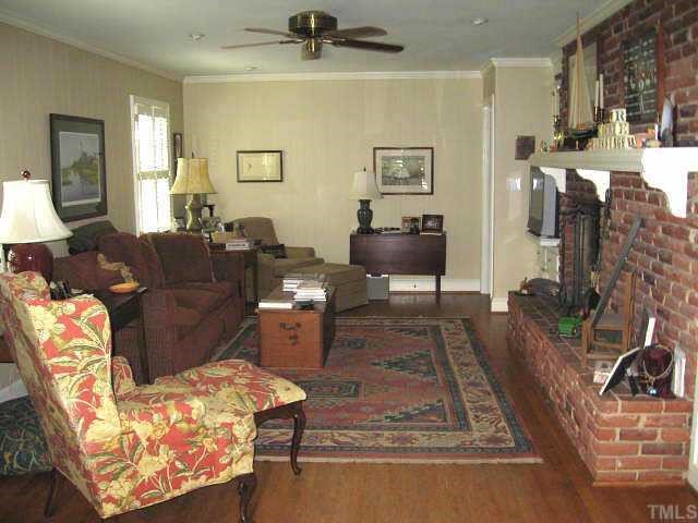2400 Ridge Road Raleigh, NC 27612 - Photo 5 of 12 Great family room with built-ins, ceiling fan, & gas log fireplace