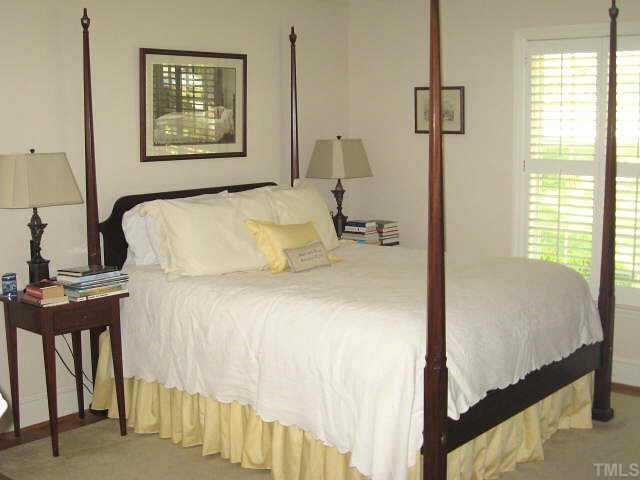 2400 Ridge Road Raleigh, NC 27612 - Photo 7 of 12 Grand master suite with ceiling fan, his/hers closets, & private bath