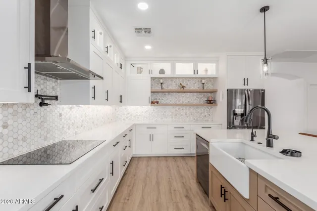a kitchen with a sink stove and cabinets