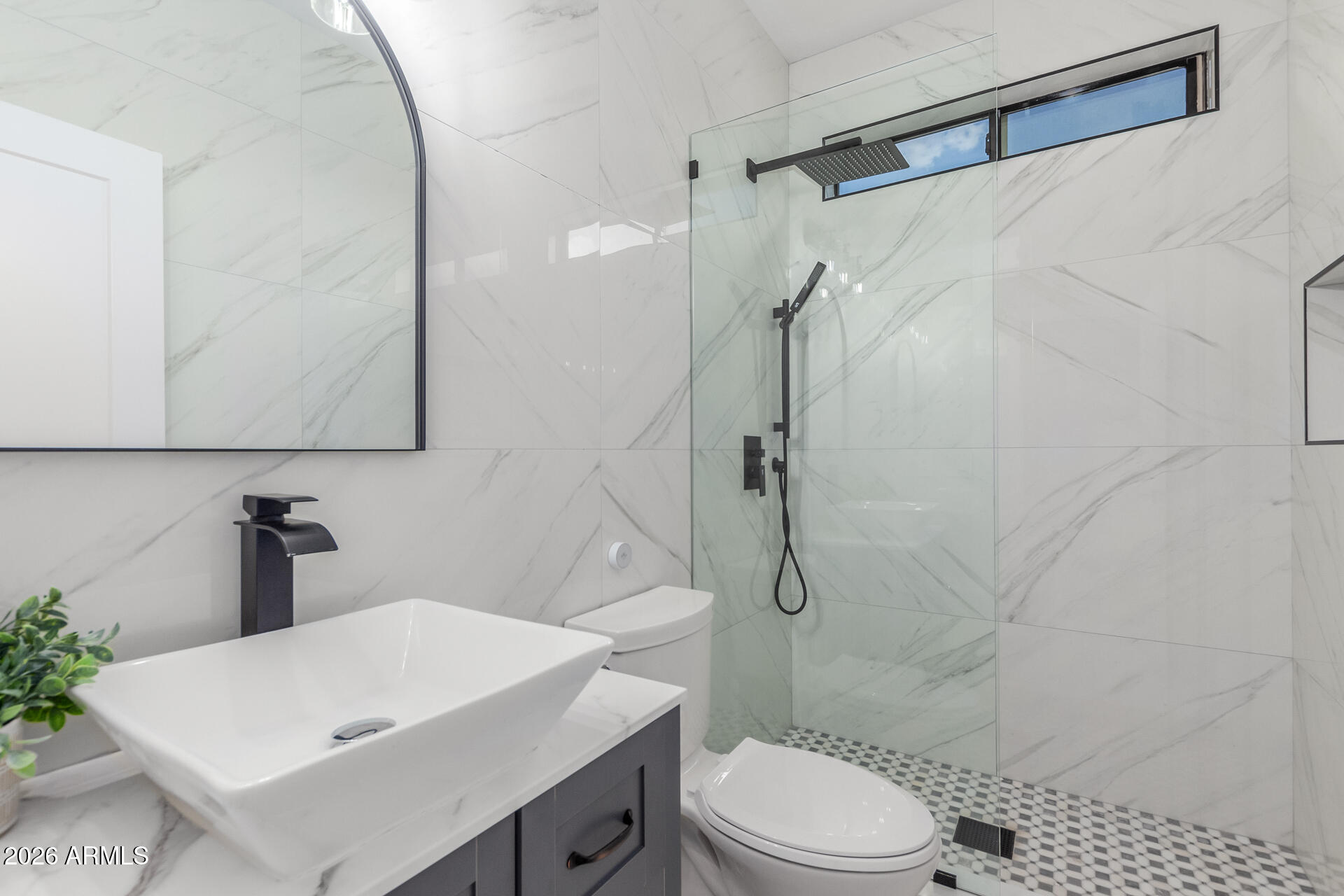 6404 West Black Hill Road Phoenix, AZ 85083 - Photo 20 of 33 a bathroom with a sink a toilet and shower