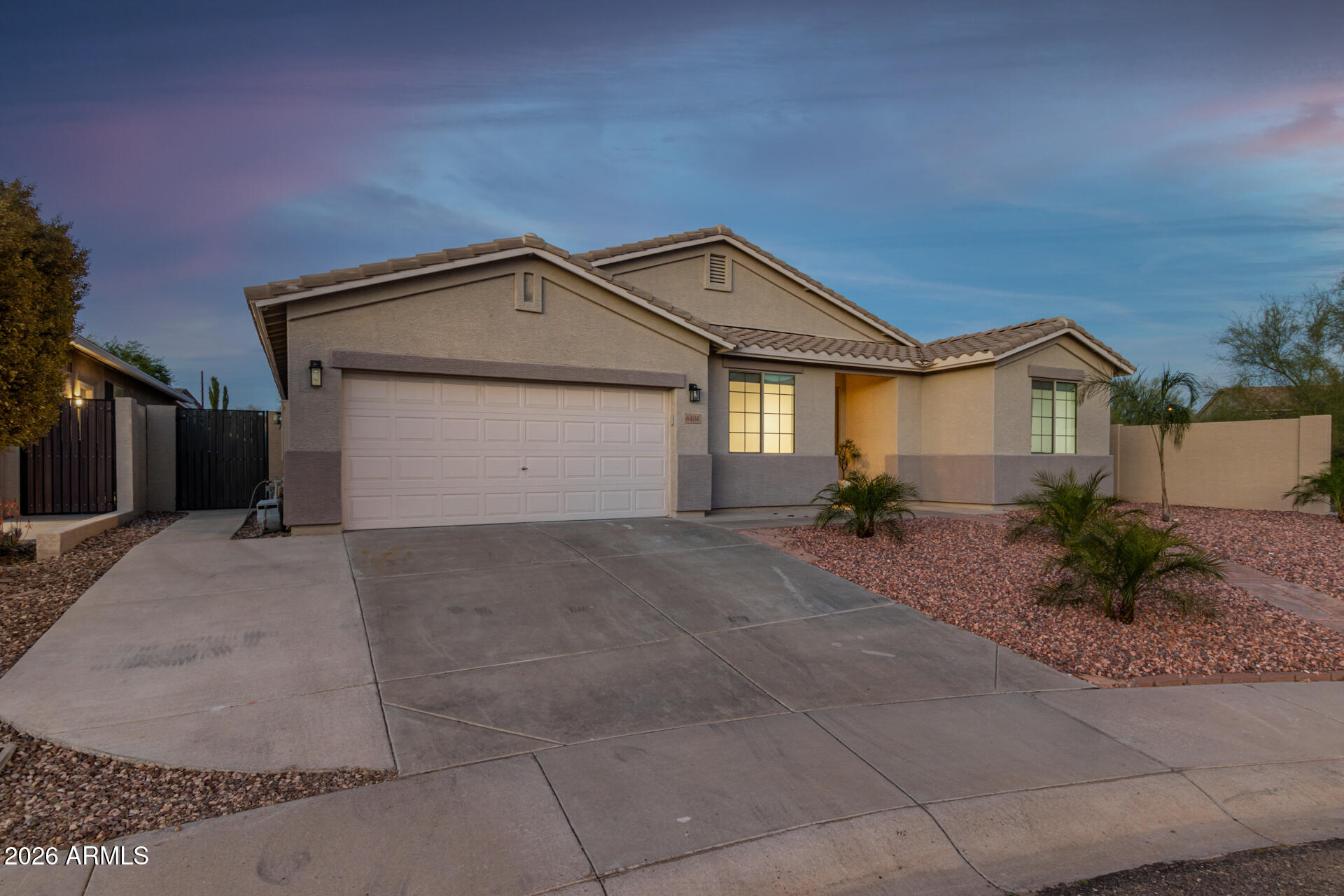 6404 West Black Hill Road Phoenix, AZ 85083 - Photo 2 of 33 a front view of a house with garden
