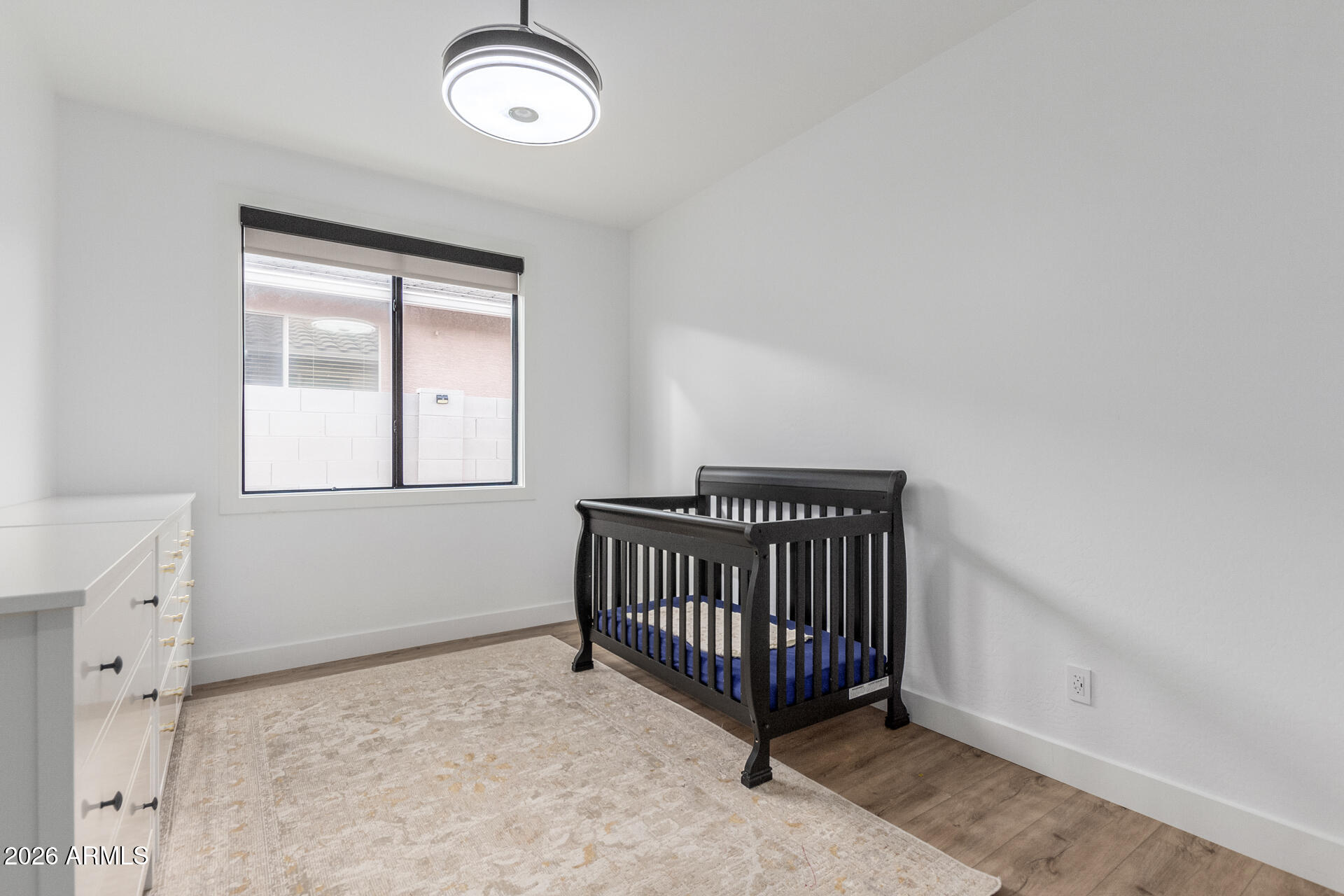 6404 West Black Hill Road Phoenix, AZ 85083 - Photo 22 of 33 a view of a livingroom with a baby crib
