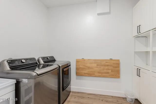 a view of storage and utility room with washer and dryer