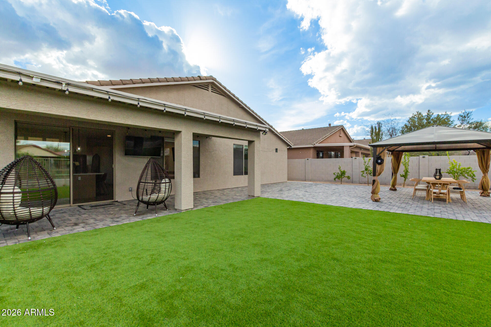 6404 West Black Hill Road Phoenix, AZ 85083 - Photo 31 of 33 a view of a house with backyard porch and sitting area