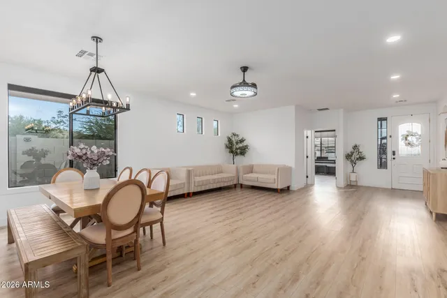 a view of a livingroom with furniture and hardwood floor