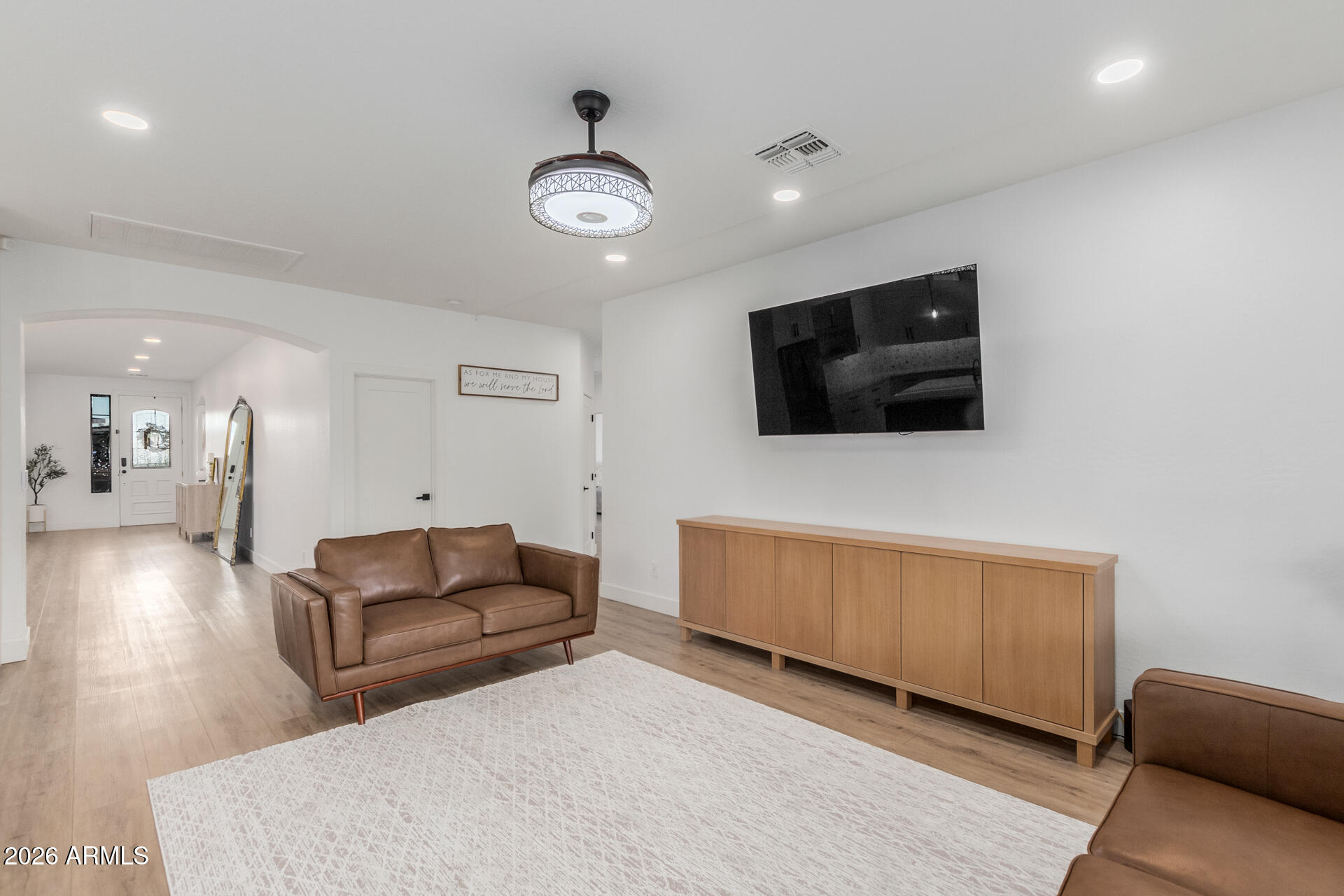 6404 West Black Hill Road Phoenix, AZ 85083 - Photo 8 of 33 a living room with furniture and a flat screen tv