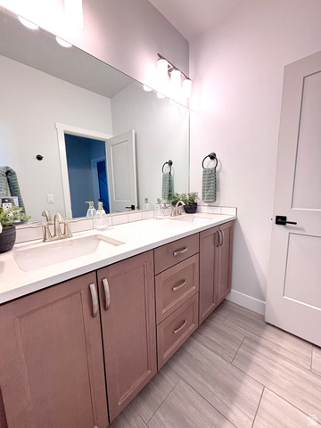 429 East Treasure Road Washington, UT 84780 - Photo 16 of 20 Double vanity featuring two integrated sinks, brushed nickel faucets, and a white countertop
