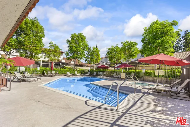 a view of a chairs and table in the patio