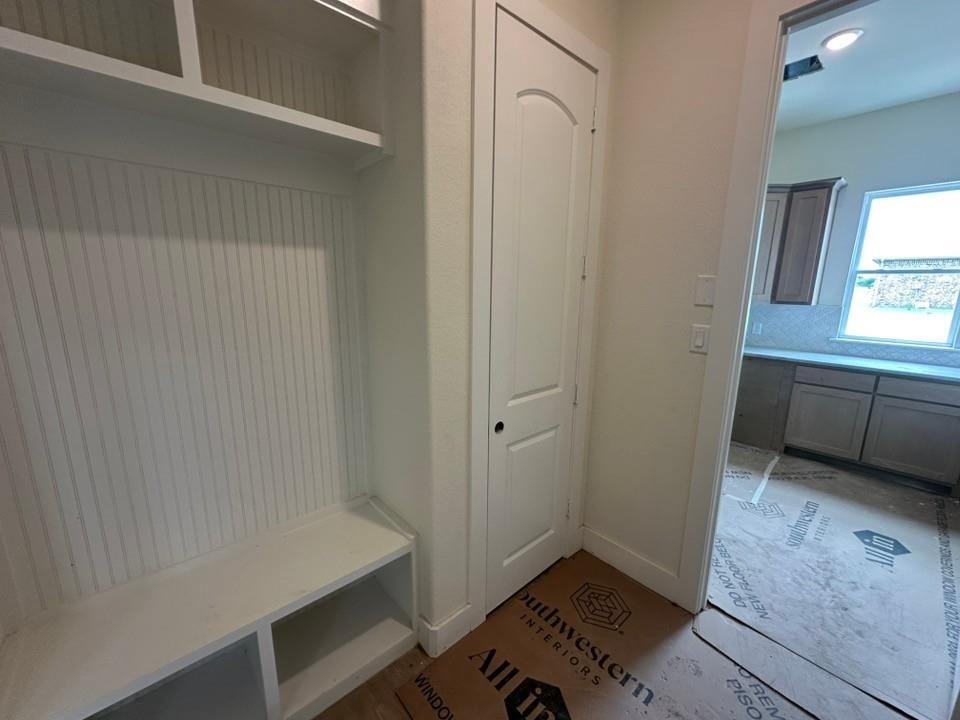 205 Cobb Road Leonard, TX 75452 - Photo 14 of 28 Built-in storage bench with beadboard backing and upper shelving