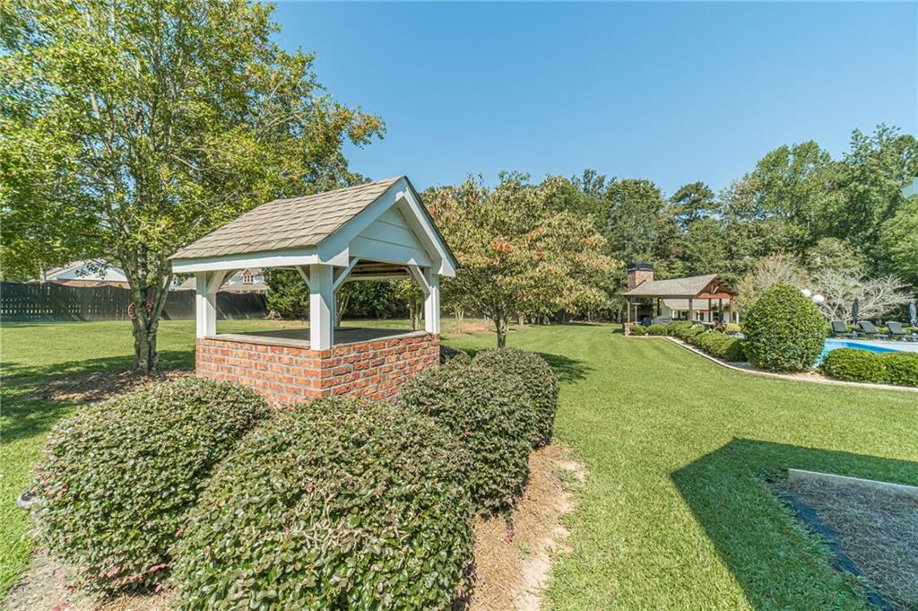 1600 Beagle Run Monroe, GA 30656 - Photo 12 of 103 a view of a house with garden and a trees