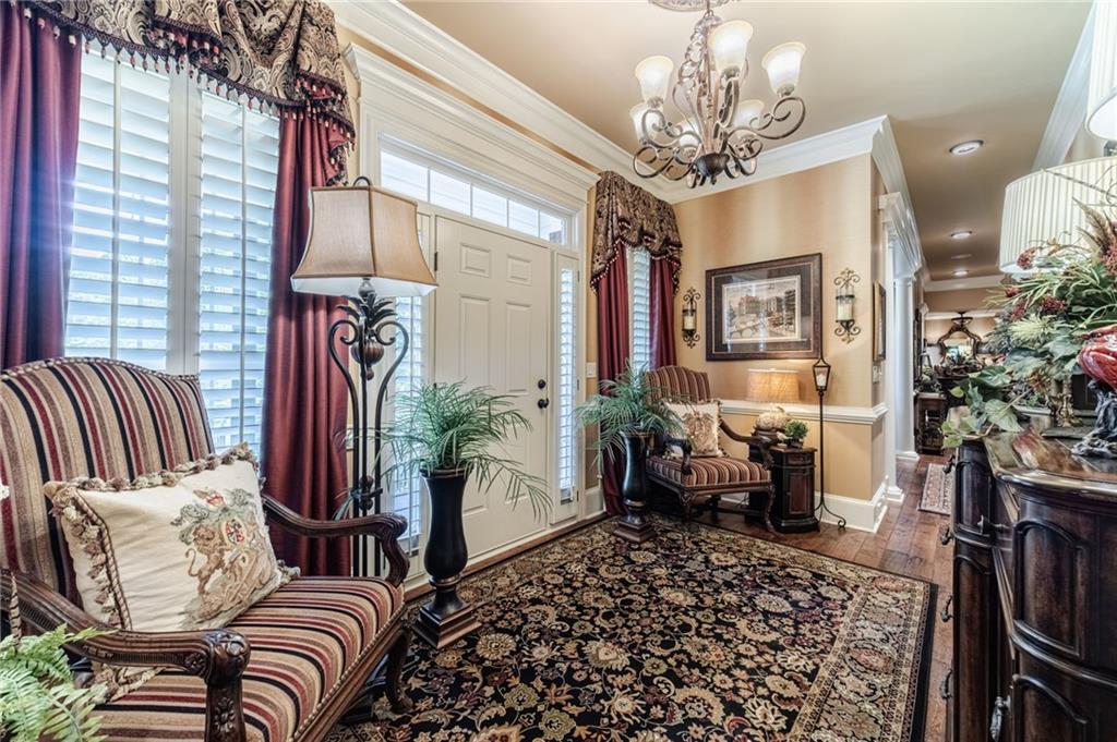 1600 Beagle Run Monroe, GA 30656 - Photo 17 of 103 a living room with furniture a chandelier and a rug
