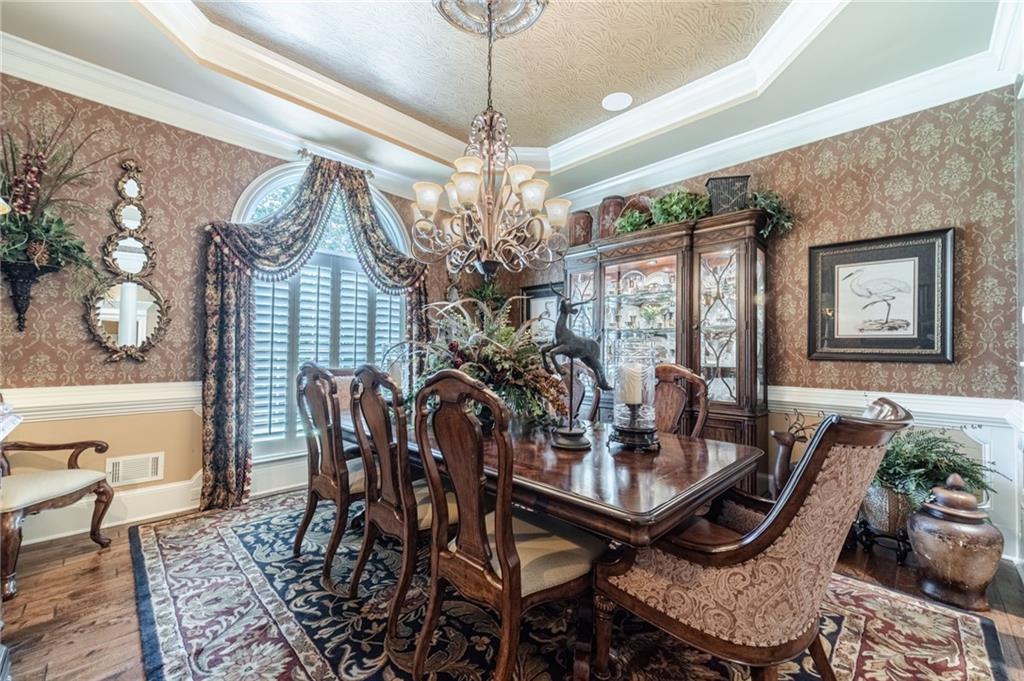 1600 Beagle Run Monroe, GA 30656 - Photo 18 of 103 a view of a dining room with furniture window and wooden floor