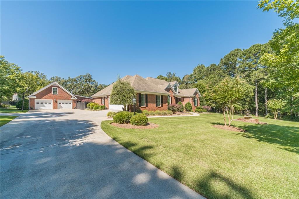 1600 Beagle Run Monroe, GA 30656 - Photo 2 of 103 a front view of a house with a yard