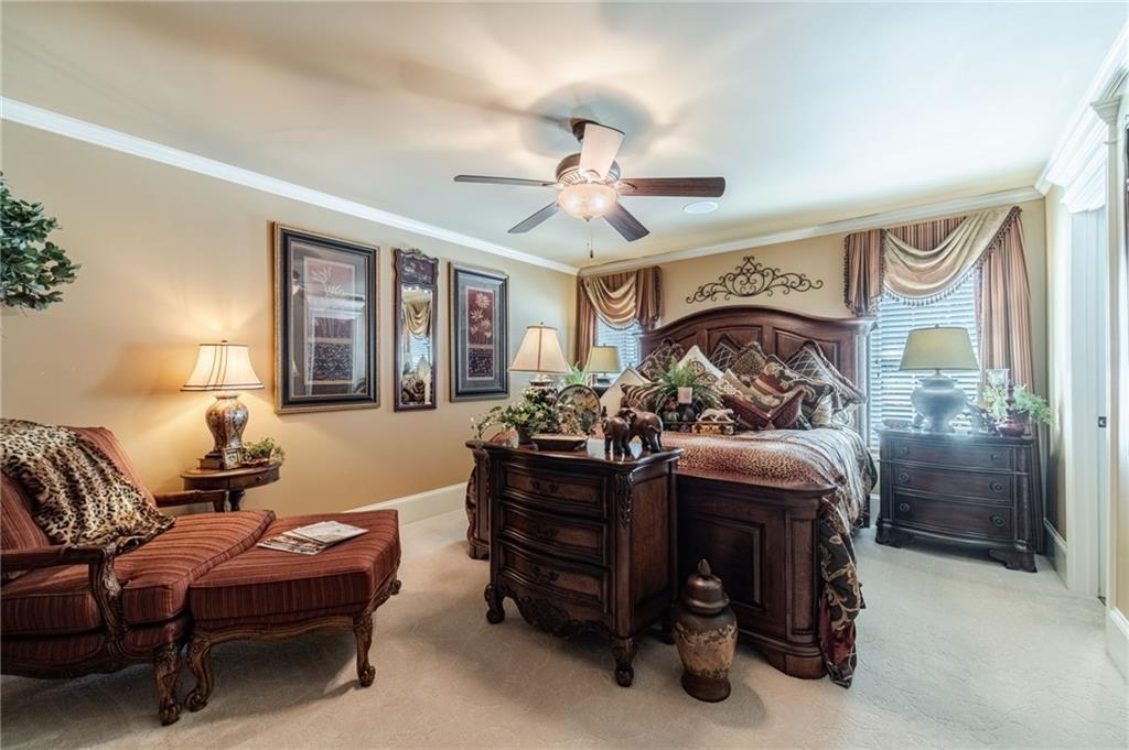 1600 Beagle Run Monroe, GA 30656 - Photo 21 of 103 a bed room with furniture and a chandelier