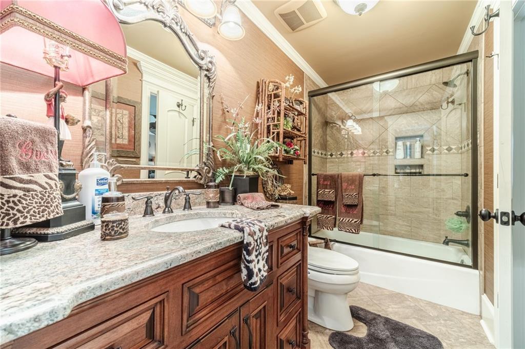 1600 Beagle Run Monroe, GA 30656 - Photo 23 of 103 a bathroom with a granite countertop sink toilet and shower