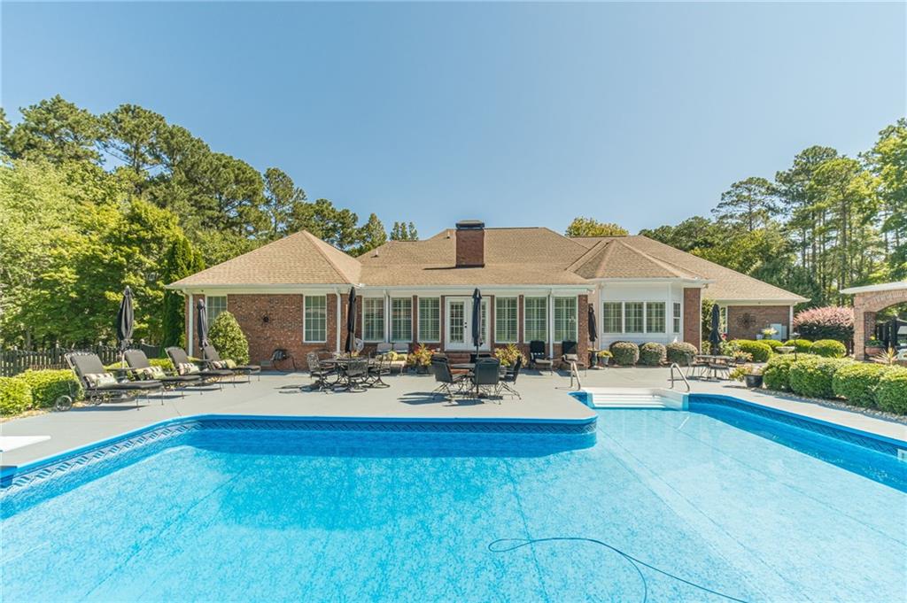 1600 Beagle Run Monroe, GA 30656 - Photo 3 of 103 a backyard of a house with barbeque oven table and chairs