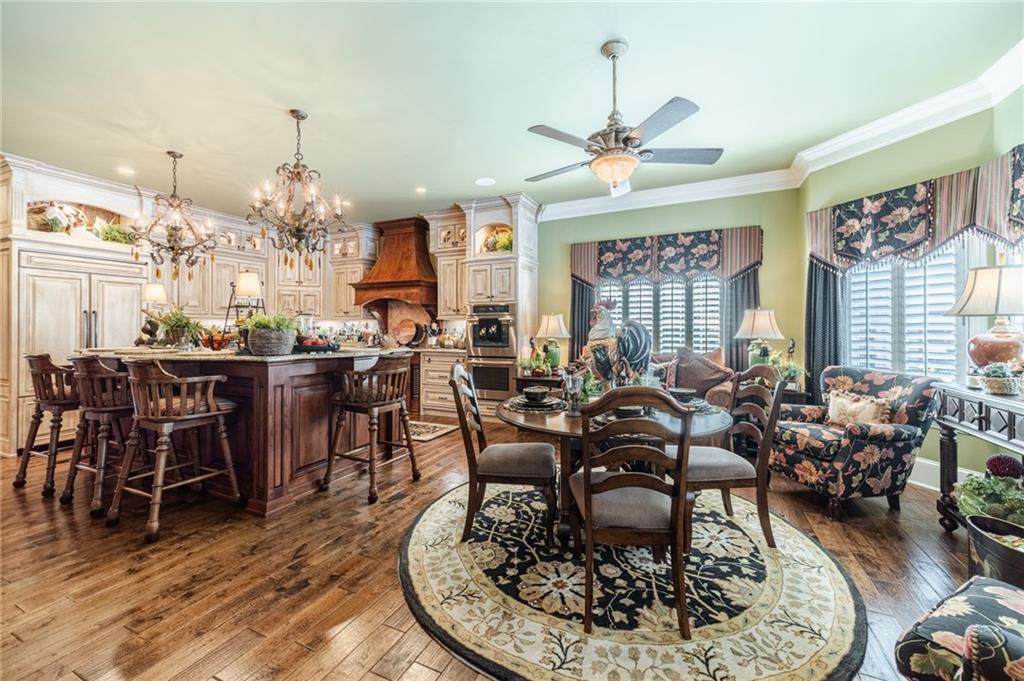 1600 Beagle Run Monroe, GA 30656 - Photo 34 of 103 a living room with lots of furniture chandelier and kitchen view