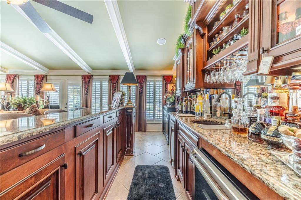 1600 Beagle Run Monroe, GA 30656 - Photo 41 of 103 a kitchen with stainless steel appliances granite countertop sink stove and cabinets