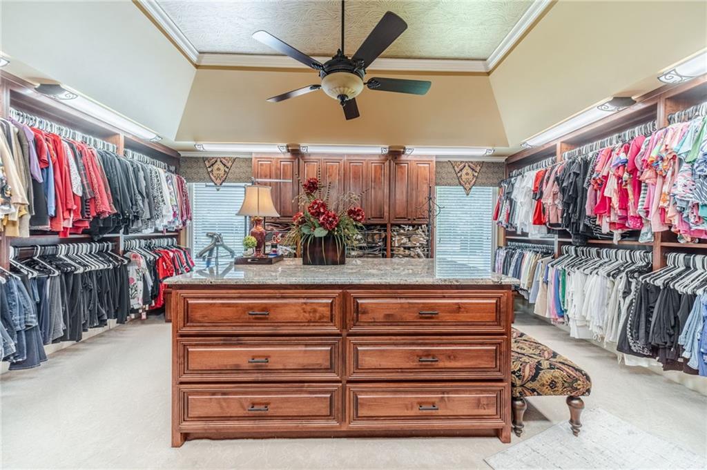 1600 Beagle Run Monroe, GA 30656 - Photo 53 of 103 a view of walk in closet with clothes and shoes