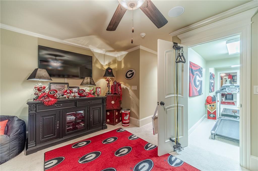 1600 Beagle Run Monroe, GA 30656 - Photo 59 of 103 a living room with furniture and a flat screen tv