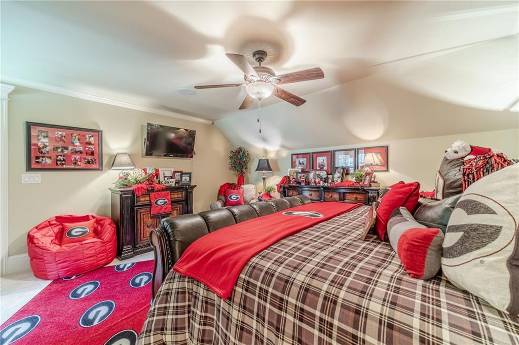 1600 Beagle Run Monroe, GA 30656 - Photo 63 of 103 a bedroom with furniture and a chandelier