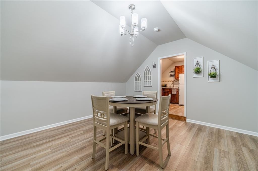 1600 Beagle Run Monroe, GA 30656 - Photo 66 of 103 a view of a dining room with furniture and wooden floor