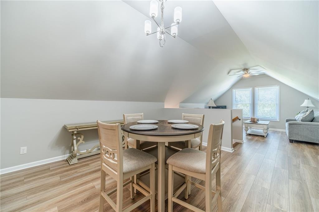 1600 Beagle Run Monroe, GA 30656 - Photo 67 of 103 a view of a dining room with furniture and wooden floor