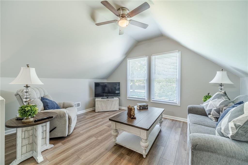 1600 Beagle Run Monroe, GA 30656 - Photo 68 of 103 a living room with furniture and a flat screen tv