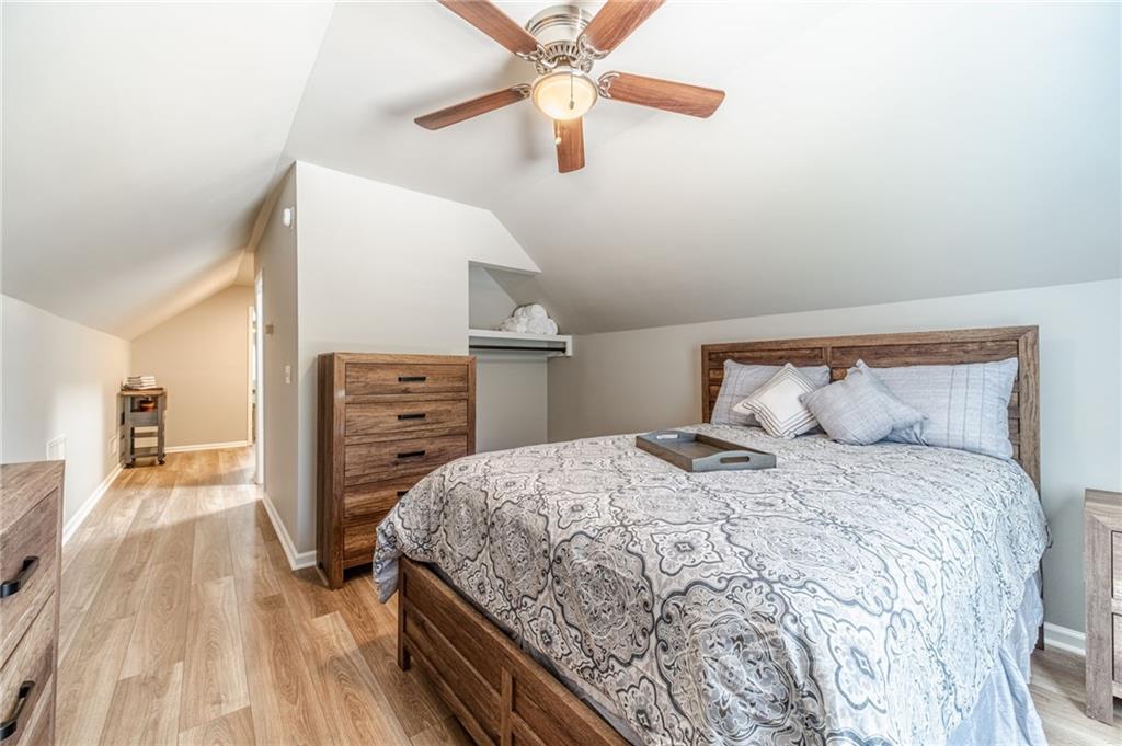 1600 Beagle Run Monroe, GA 30656 - Photo 73 of 103 a bedroom with a bed and a flat tv screen