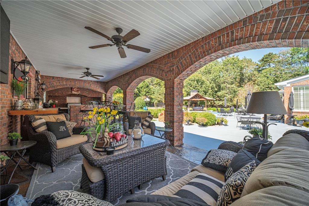 1600 Beagle Run Monroe, GA 30656 - Photo 79 of 103 a living room with furniture and a floor to ceiling window